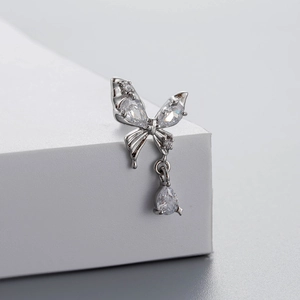 Silver butterfly cartilage stud with sparkling zircon stones and a teardrop pendant