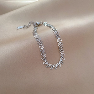 Detail of silver clover leaf chain bracelet in stainless steel with lobster clasp