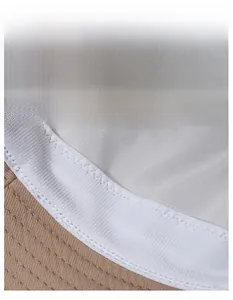 Detail of wide breathable sweatband with mesh texture inside khaki canvas sun hat