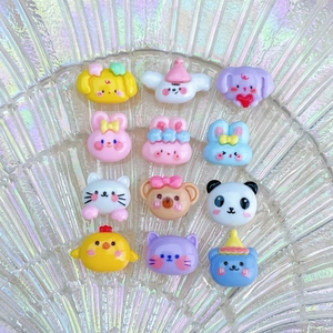 Close-up of 12 colorful resin mini cartoon animals for nail art and DIY crafts
