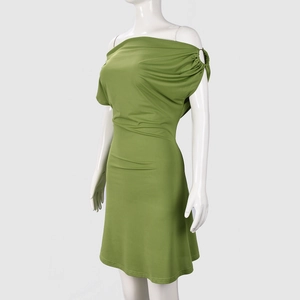 Detail of metal ring hardware and ruching on a slim fit grass green off-shoulder dress