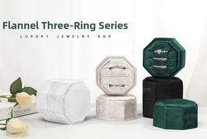 Detailed view of luxury velvet octagonal jewelry boxes with three ring slots in soft light