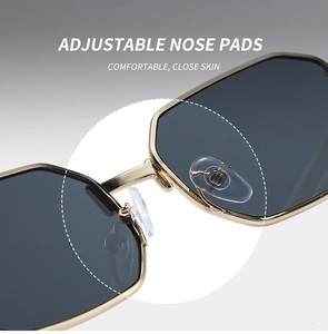 Close-up of adjustable silicone nose pads on gold metal polygon sunglasses