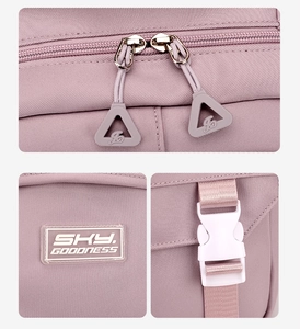 Close-up of lavender fabric texture with metal zippers and plastic buckles on backpack