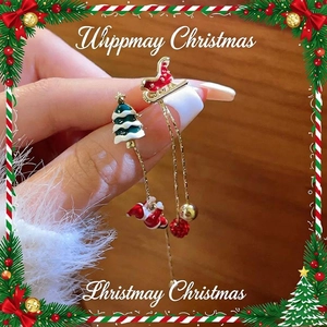 Asymmetric Christmas earrings with Santa and Xmas tree featuring gold tassels