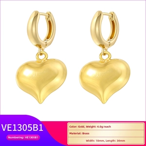 Detailed view of gold plated brass heart drop earrings with dimensions 18mm by 34mm