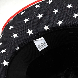 Close-up of woven paper fiber texture and interior material label of the cowboy hat