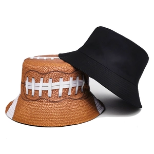 Reversible bucket hat featuring classic black canvas and unique American football texture print