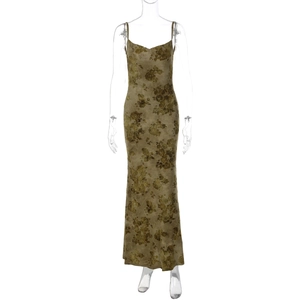Detailed view of the backless tie-dye maxi dress with floral print and metal chain decor