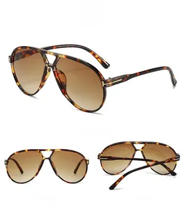 Detailed views of tortoise shell pilot sunglasses with gradient brown lenses and T hinges