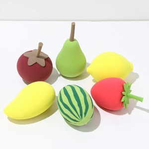 Detailed set of fruit-shaped makeup sponges featuring strawberry, mango and lemon designs