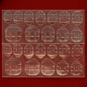 Adhesive tabs for press-on nails with 24 transparent double-sided stickers on a sheet