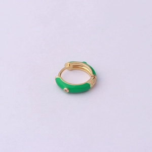 Detail of green enamel earring with gold-plated interior and a small clear zircon stone