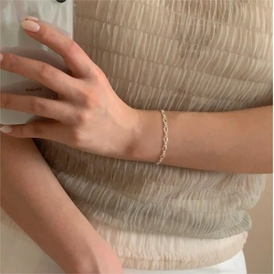 Minimalist S925 sterling silver geometric chain bracelet shown on a woman wrist