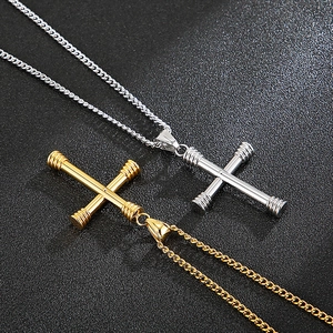 Detail of gold and silver cross pendants with threaded ends on classic Cuban chains