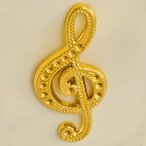Close-up of golden music note pendant with detailed granular texture on 304 stainless steel