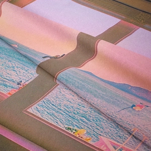 Detail of digital print tapestry showing seaside sunset waves and smooth fabric texture