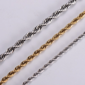 Golden and silver stainless steel rope chains in various thicknesses shown from a diagonal angle