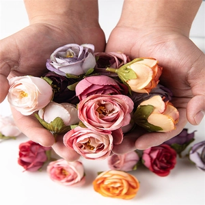 Macro shot of colorful silk artificial rose heads for DIY crafts and wedding decor