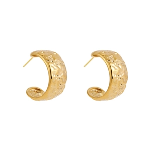 Detailed macro of 14K gold stainless steel C-shaped earrings with hammered texture