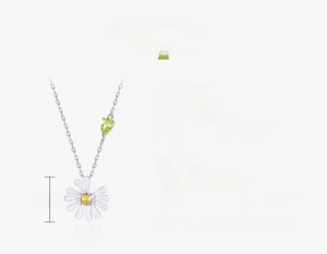 Macro detail of S925 sterling silver daisy necklace with green pear-cut zircon stone