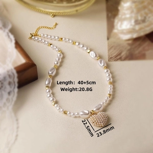 Detail view of pearl heart necklace showing 40+5cm length and 20.8g weight specs