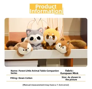 Close-up of soft plush raccoon and fox dolls made of faux fur with down cotton filling