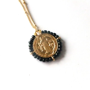 Vintage gold Saint Benedict coin necklace with black beaded round religious pendant