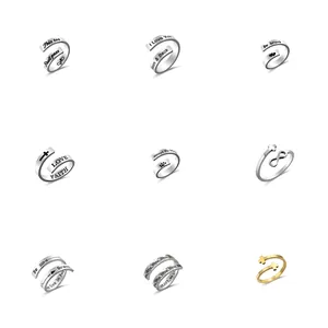Collection of minimalist stainless steel adjustable rings with engraved inspirational quotes