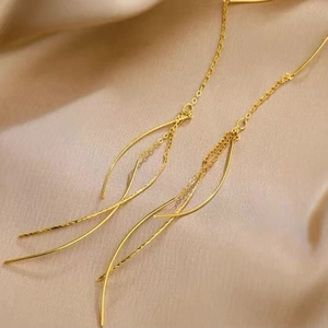Elegant gold S925 sterling silver long tassel threader earrings on beige silk