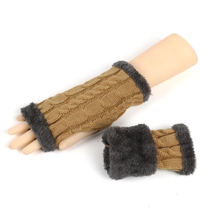 Close-up of thick cable knit fingerless gloves with soft faux fur cuffs for winter warmth