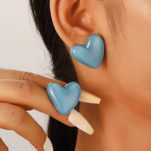 Blue heart stud earrings with a 3D aesthetic design for a trendy and stylish female look
