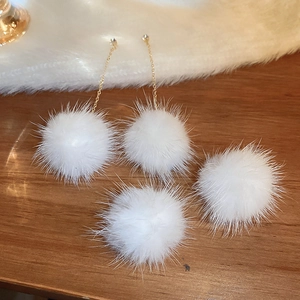 Elegant white mink fur ball drop earrings with gold chain and crystals for winter