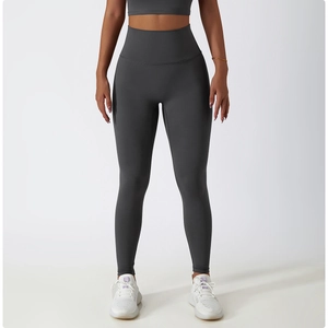 Detail view of high-waisted dark grey fitness leggings with seamless shaping design