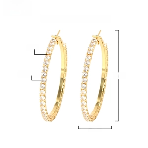 Macro view of 50mm gold-plated brass hoop earrings with AAA+ zircon micro-pave setting