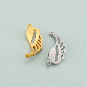 Detail of hollow angel wing pendants in gold and silver finish with dual attachment rings