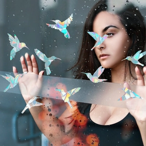 Rainbow holographic hummingbird window decals showing colorful prism effects on glass