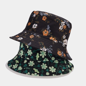 Floral reversible bucket hat for sun protection with black fabric and colorful flower patterns