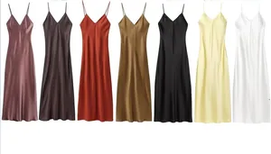 Detail showcasing seven vibrant colors of V-neck satin slip dresses with a silky finish