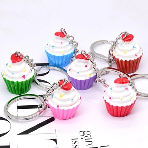 Set of colorful heart cupcake keychains with vibrant cream topping and sprinkles