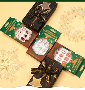 Christmas press-on nail set featuring Santa Claus, snowman, and glitter red-green patterns