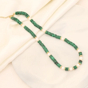 Elegant natural stone and pearl necklace with green and black beads on beige silk