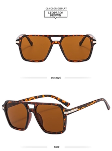 Macro detail of leopard print frames and brown lenses on stylish double bridge sunglasses