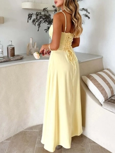 Elegant pale yellow backless midi dress with corset-style criss-cross tie detailing