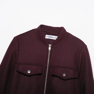 Wine red long sleeve soft zip jacket with pockets and detailed fabric texture