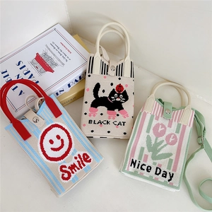 Three cute knitted crossbody bags with cartoon patterns like cat, flower and smile