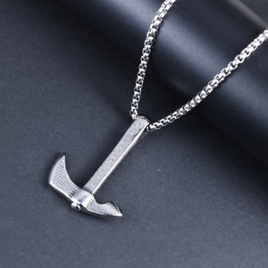 Detailed close-up of retro punk axe pendant with textured finish on stainless steel chain