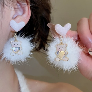 Detail of cute white fuzzy heart earrings with plush ball and bear pendant charm