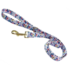 Close-up of floral pet leash with pink blue fabric and golden metal swivel snap hook