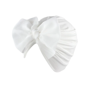 Detailed texture of white ribbed knit baby turban with large chiffon bow decoration